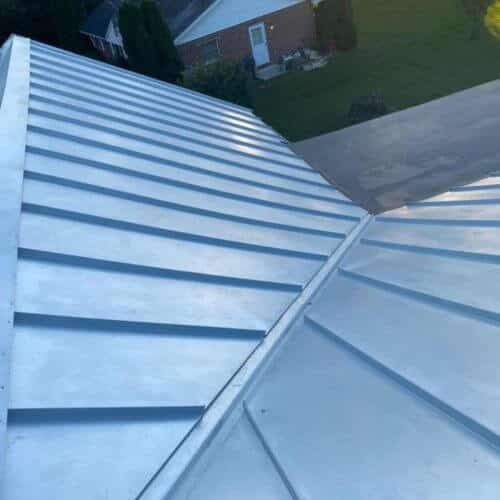 top of gray metal residential roofing on home