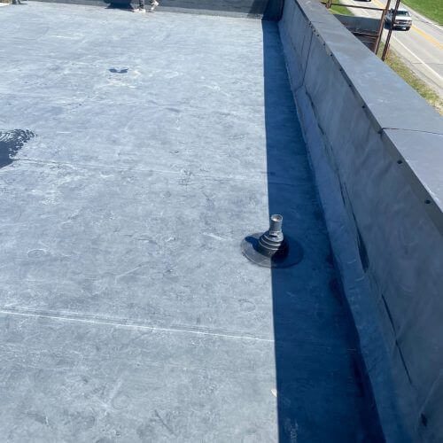 gray rubber roofing on flat roof